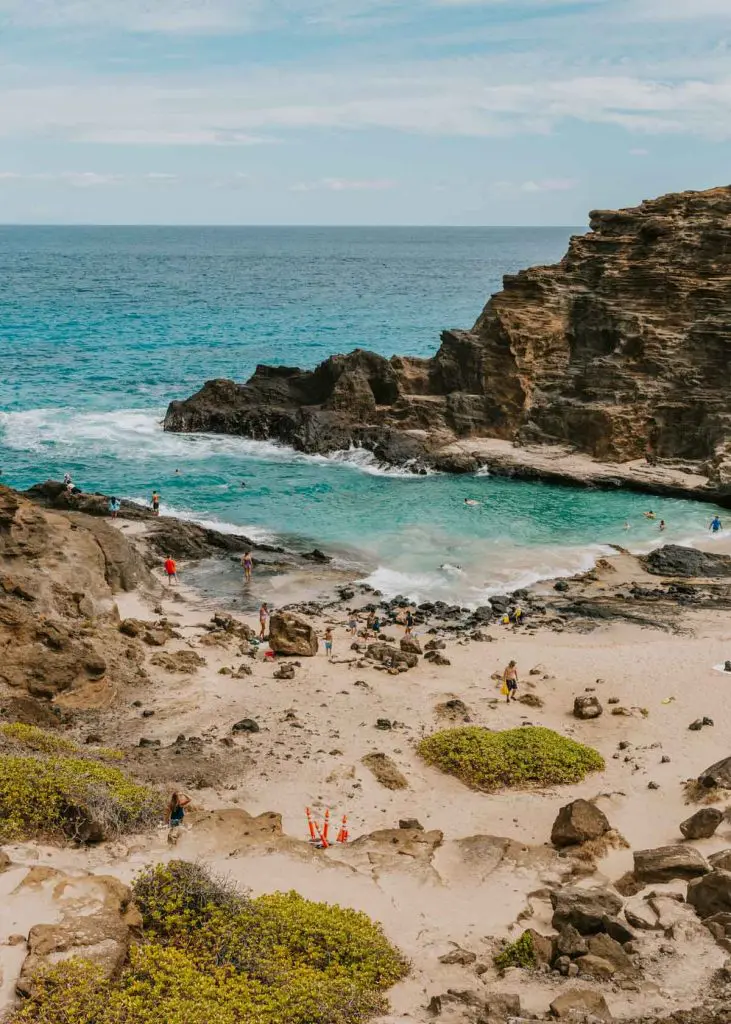 View from above a small cove on Oahu called Halona Beach Cove, one of the best places to stop on an Oahu roadtrip