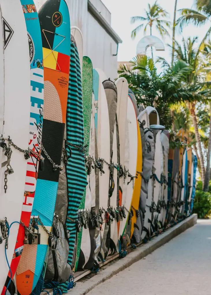 Surfboards line an alleyway in Waikiki, Honolulu, one of the best places to visit on your first trip to Hawaii