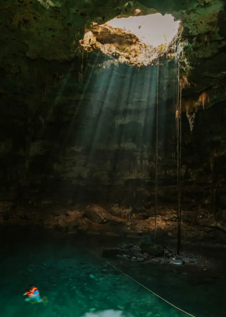Light streaming down in Cenote Samula at Dzitnup Cenotes park