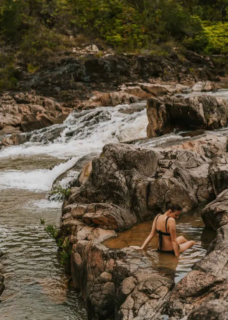 Woman soaking in Rio On Pools in Belize