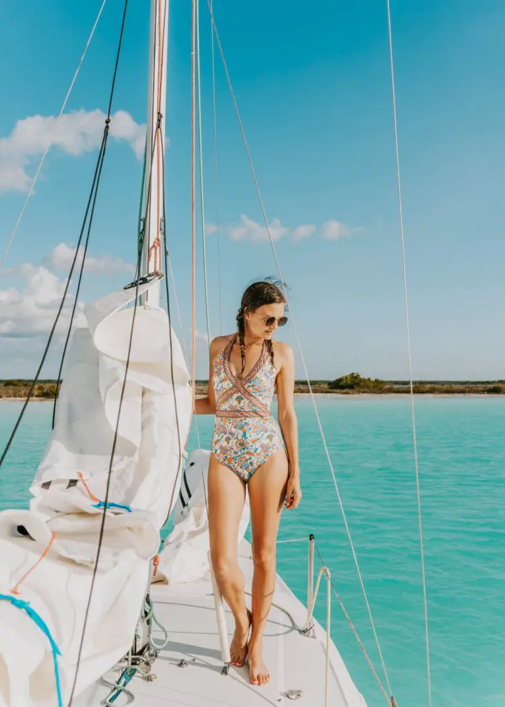 Standing on a boat at pirates channel during a Bacalar boat tour