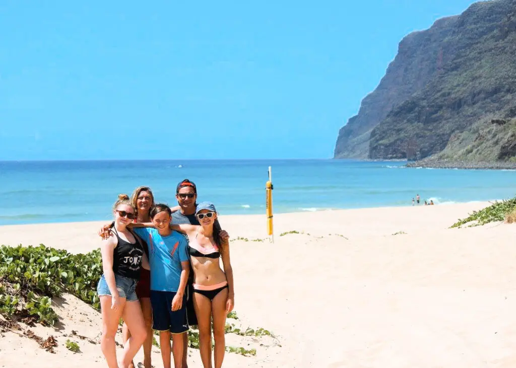 Family photo at Polihale Beach, which is one of the most difficult beaches to get to on Kauai. It's a true Kauai hidden gem!