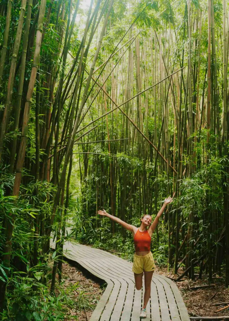 Woman hiking the Pipiwai Trail, an essential in this Road to Hana itinerary