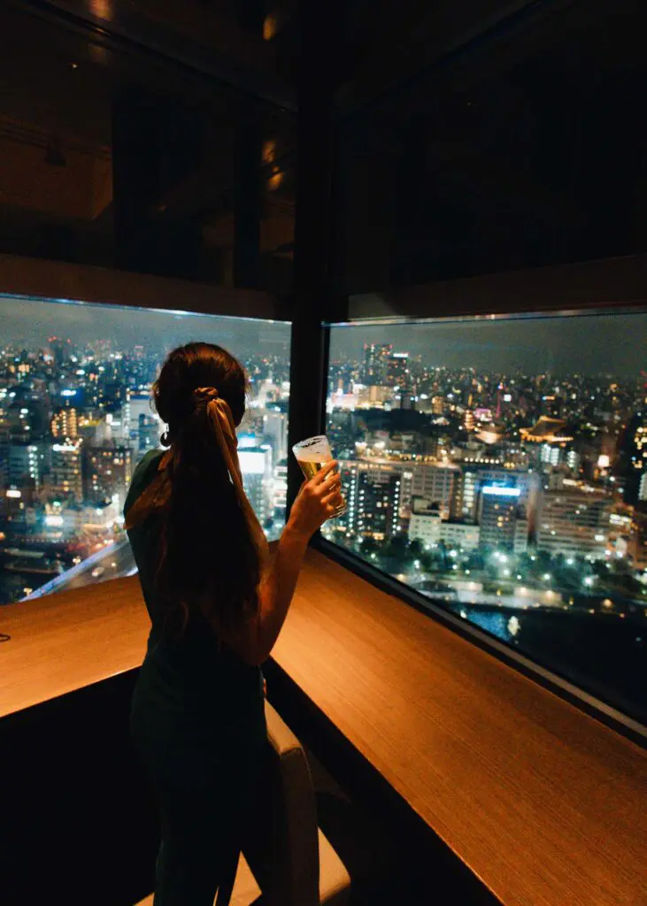 Sipping Asahi beer overlooking the city in Tokyo