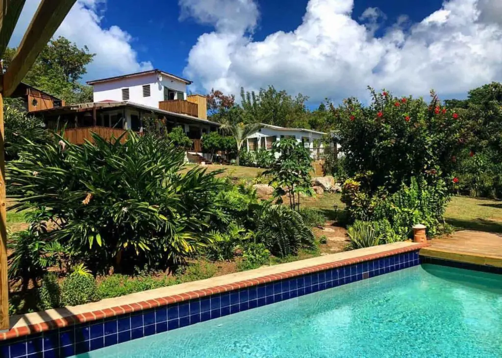 Pool, gardens and hotel buildings at Finca Victoria on Vieuqes island, a unique place to stay in Puerto Rico