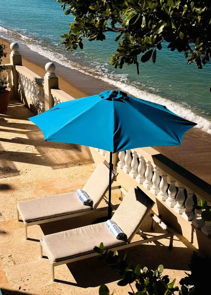 Sun lounge chairs with the waves in the background at a hotel in Rincon Puerto Rico