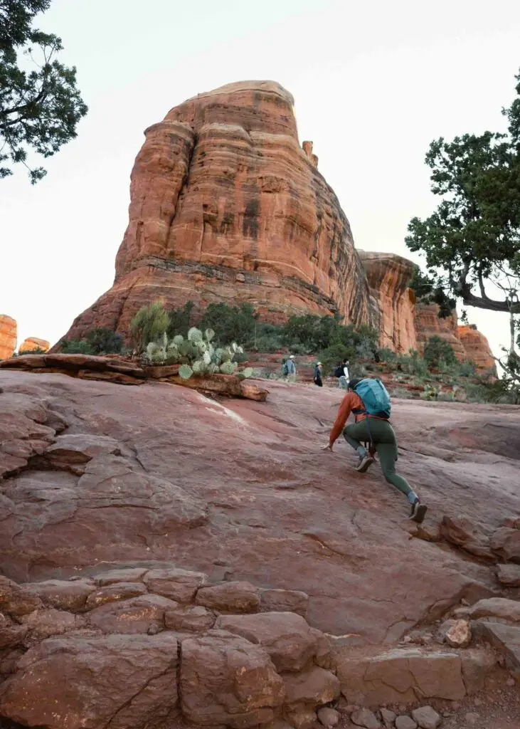 Scrambling up red rock toward Cathedral Rock in Sedona