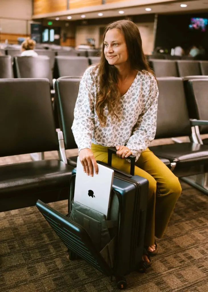 Putting my laptop into my suitcase at the airport