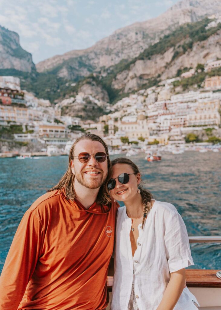My husband and I with Positano behind us on an Amalfi Coast Boat tour