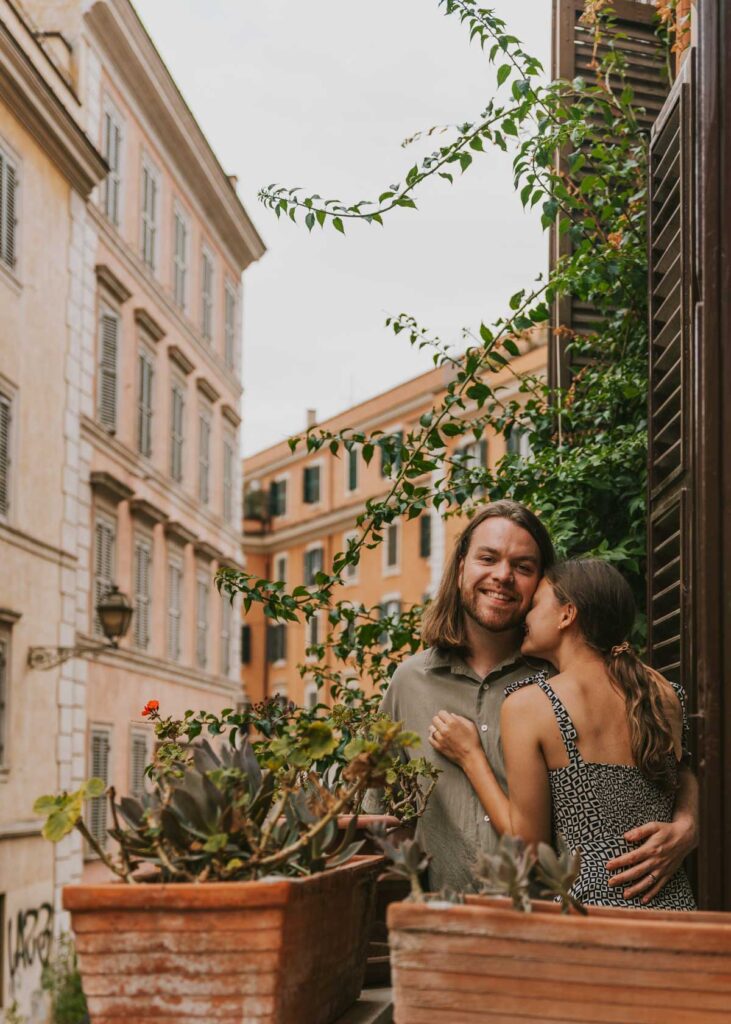 Couple embarcing on a balcony in Trastevere, Rome