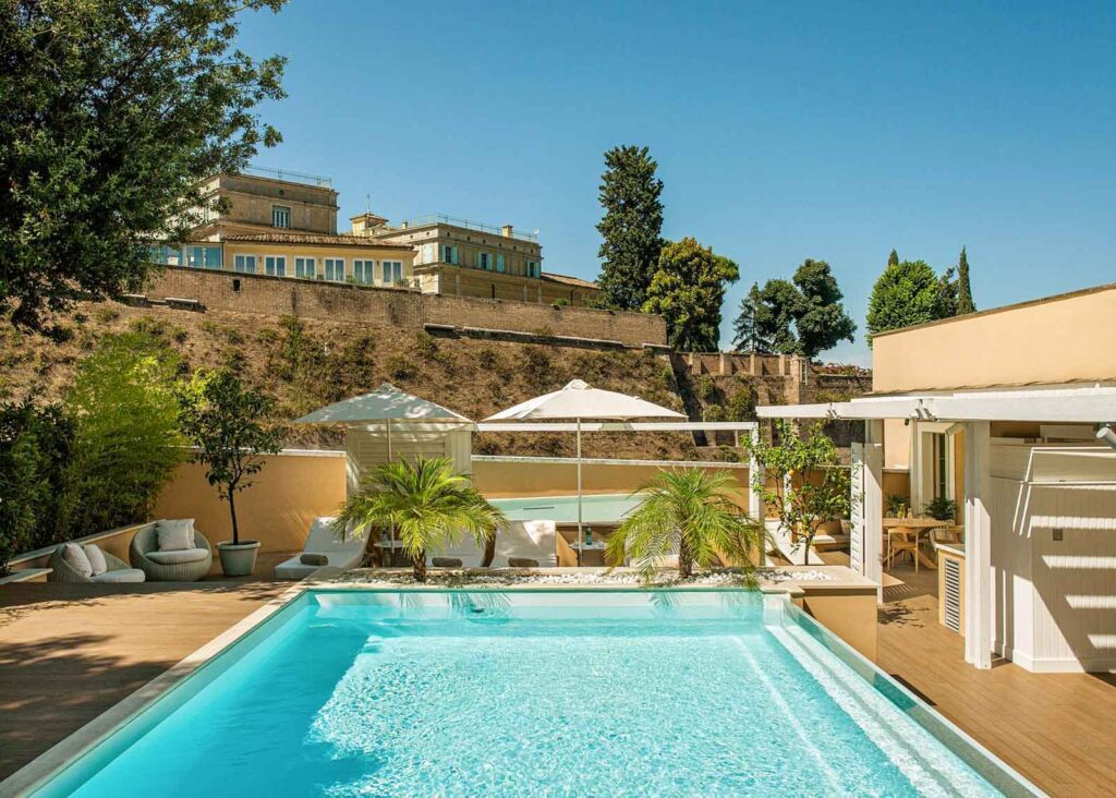 Pool at the walled Villa Agrippina Gran Meliá, a luxury boutique hotel in Trastevere, Rome